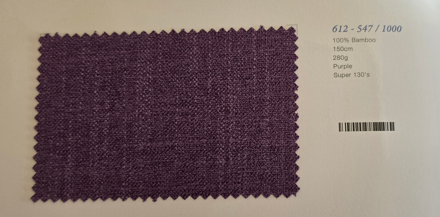 A square purple woven fabric swatch with zigzag-cut edges, shown on a white background with printed text to the right indicating material and color details.