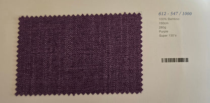 A square purple woven fabric swatch with zigzag-cut edges, shown on a white background with printed text to the right indicating material and color details.