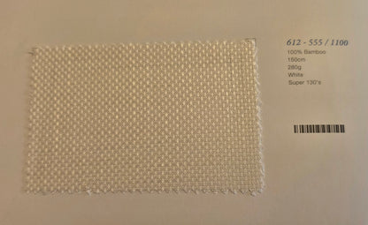 A square woven bamboo fabric swatch in white, displayed on a light beige background with printed product details on the right side.