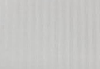 A white long-sleeve button-up shirt with subtle vertical texture, hanging on a wooden hanger from a rustic wooden wall hook against a warm off-white wall.
