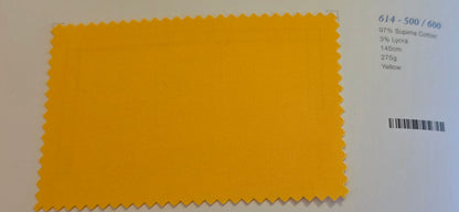 A yellow fabric color swatch with serrated edges on a white background, next to printed text showing color code 614 - 500 / 600 and material details.
