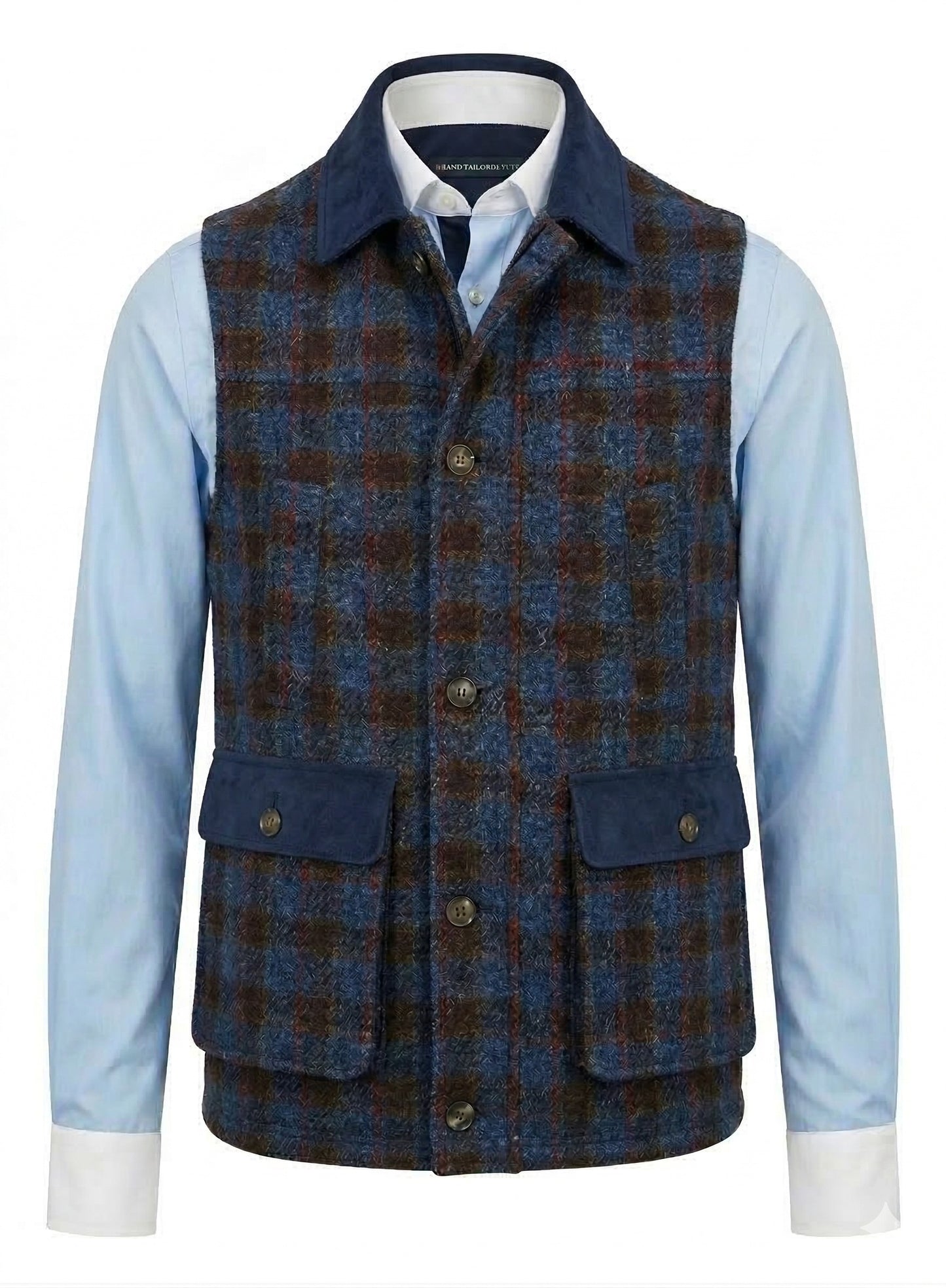 Blue and Red and  brown plaid vest over a light blue shirt on a white background