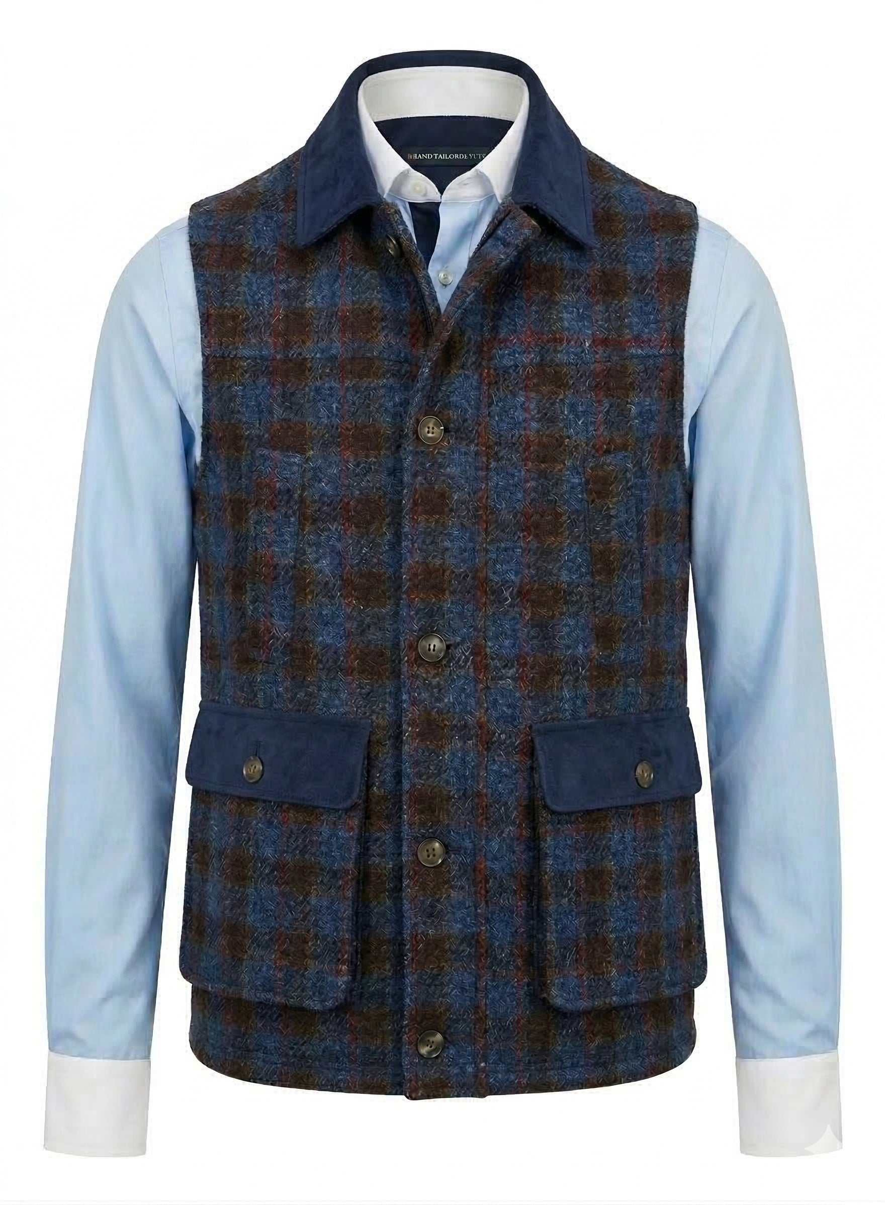 Blue and Red and  brown plaid vest over a light blue shirt on a white background