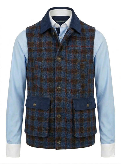 Blue and Red and  brown plaid vest over a light blue shirt on a white background