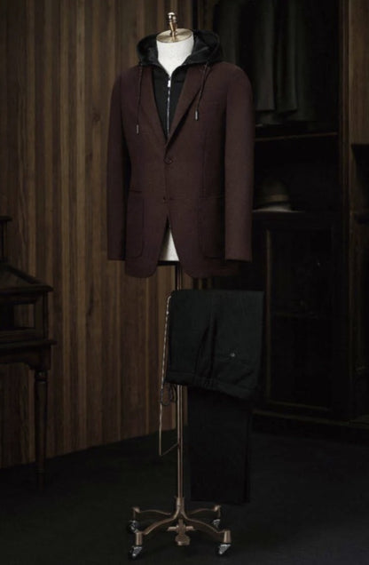 Brown coat on a mannequin against a wooden paneled wall.