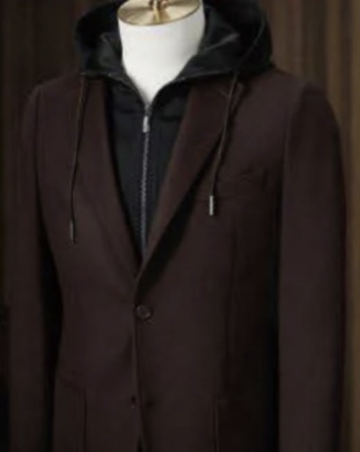 Brown coat with a hood on a mannequin against a plain background