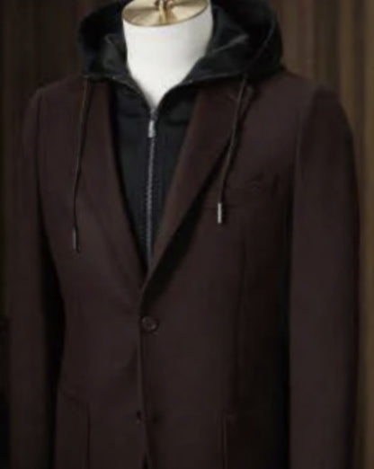 Brown coat with a hood on a mannequin against a plain background