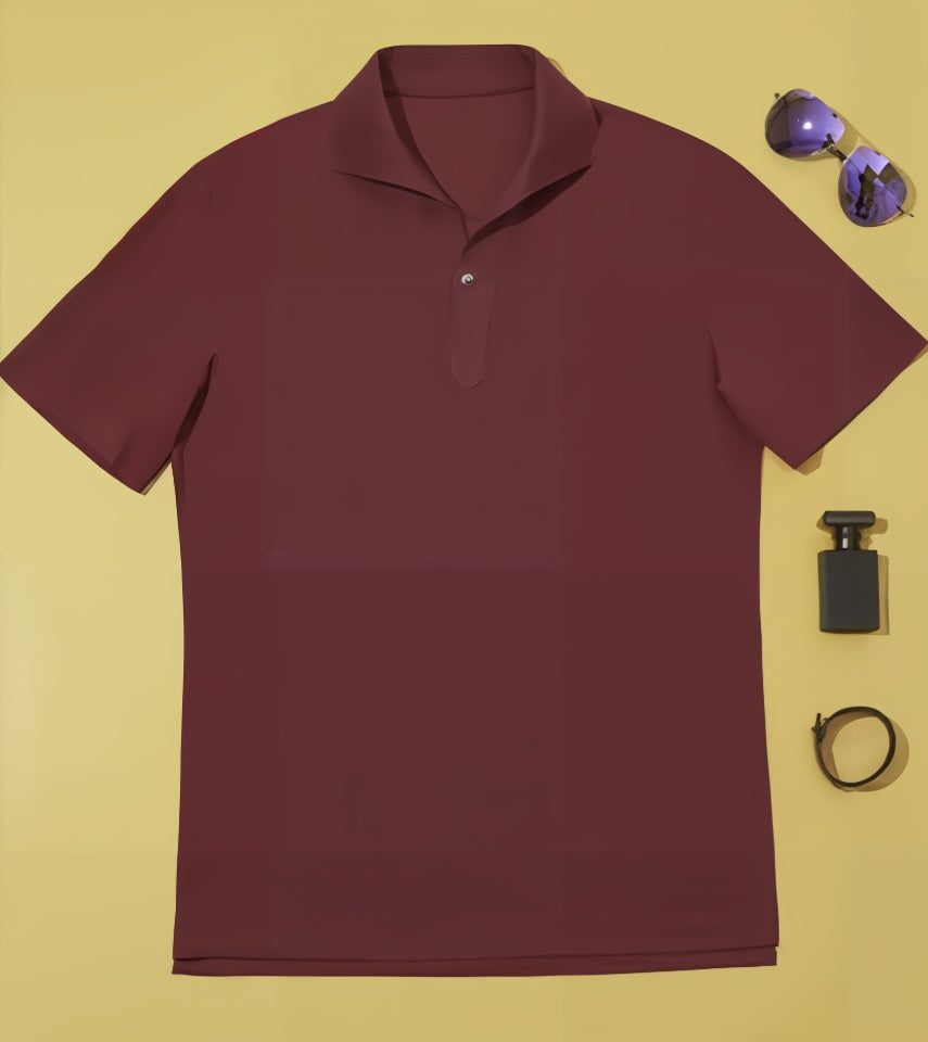 Burgundy polo shirt with sunglasses, bottle, and watch on a yellow background