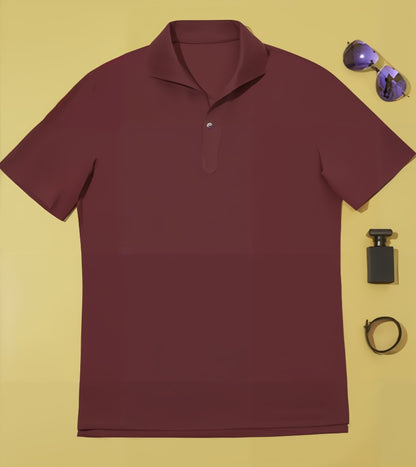 Burgundy polo shirt with sunglasses, bottle, and watch on a yellow background