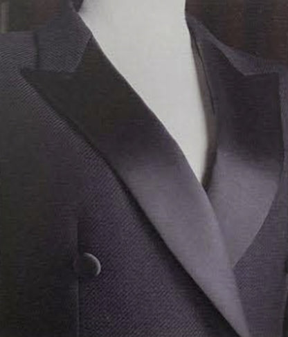 Close-up of a dark gray blazer on a mannequin