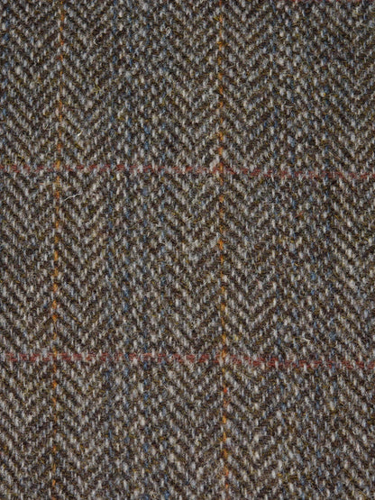 Close-up of a herringbone patterned fabric with brown and beige colors.