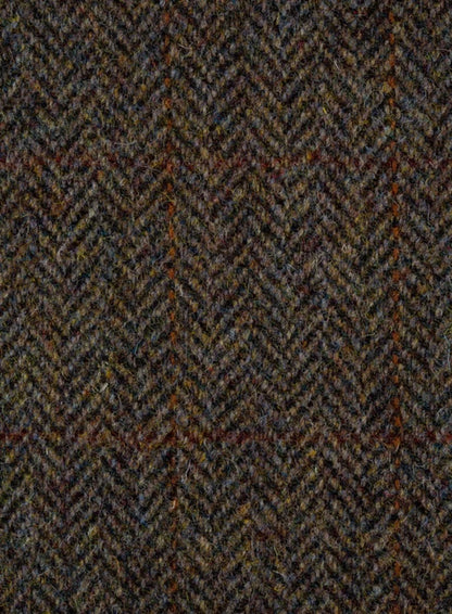 Close-up of a herringbone patterned fabric with earthy tones.