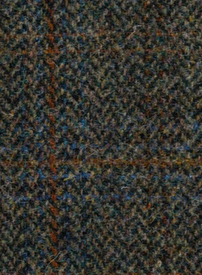 Close-up of a textured fabric with a herringbone pattern in brown, blue, and black.
