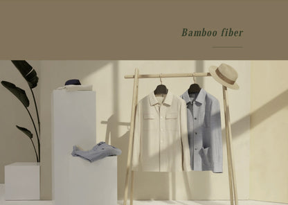 Clothing displayed on a rack with 'Bamboo fiber' text in a minimalistic setting.