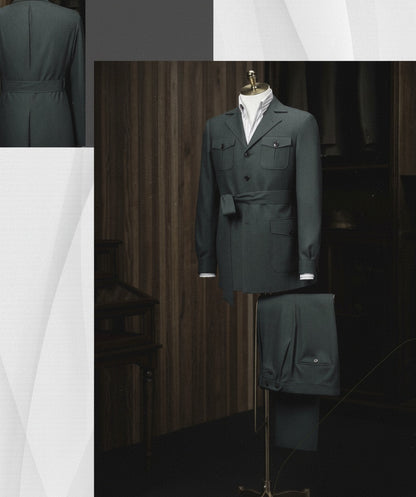 Dark green military-style jacket and pants on a mannequin against a wooden panel background.