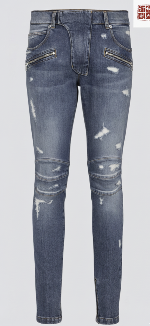 Distressed blue jeans with zippers on a light gray background