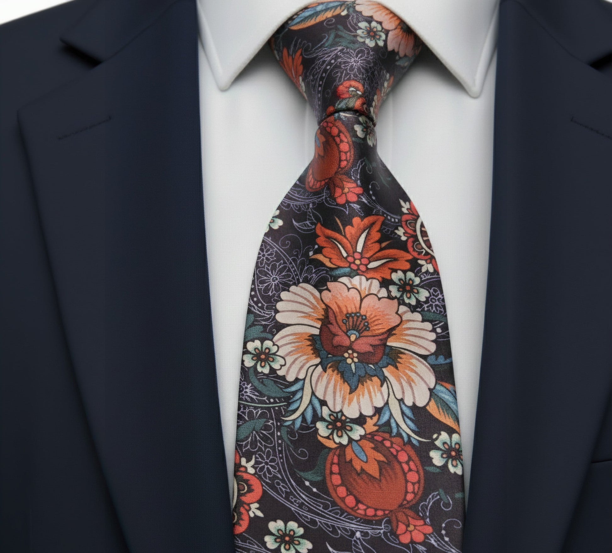 Floral patterned tie on a suit with a white shirt