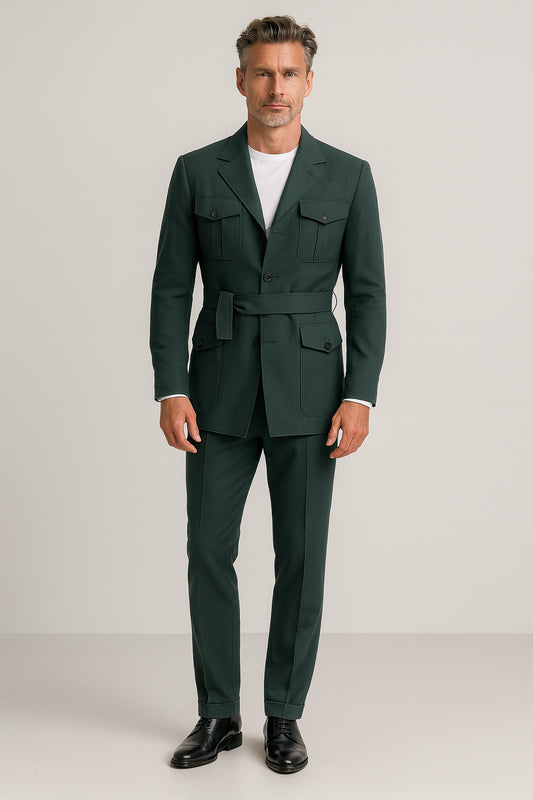Man wearing a green suit with a white shirt on a plain background