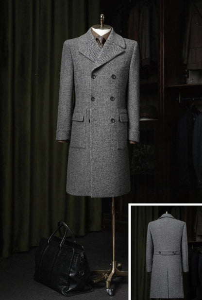 Grey overcoat on a mannequin against a dark background