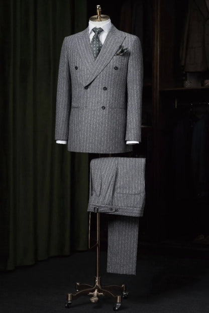 Grey pinstripe suit on a mannequin against a dark background