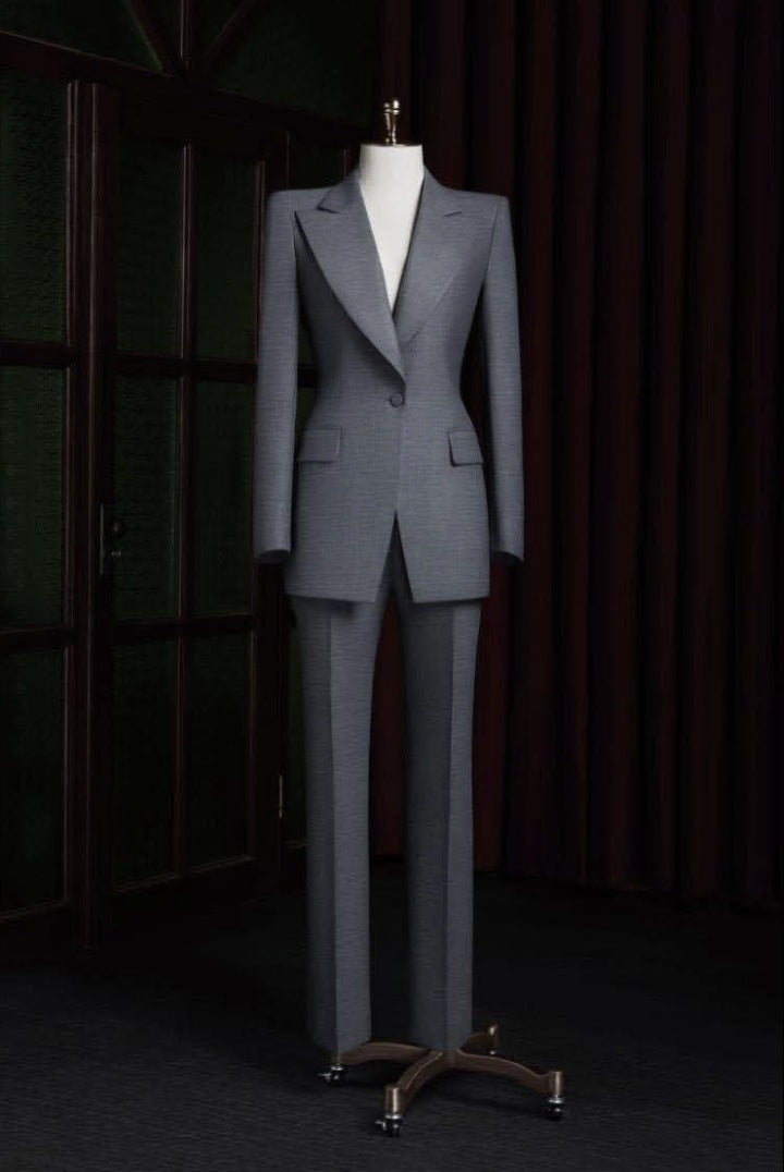 Grey suit on a mannequin against a dark background