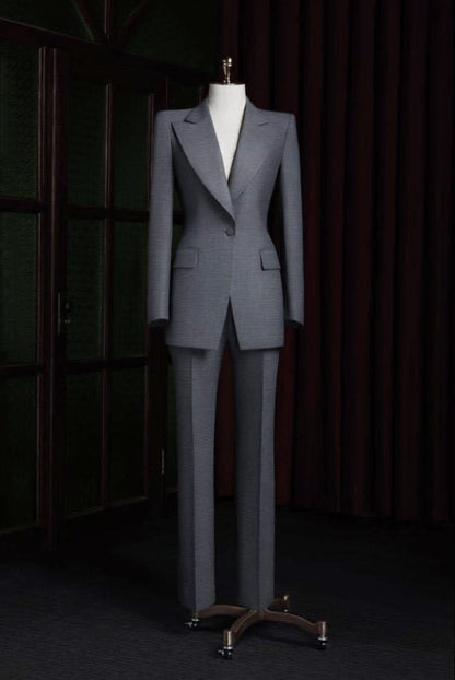 Grey suit on a mannequin against a dark background