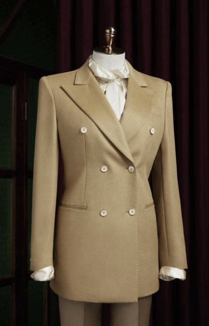 Ladies Beige double-breasted suit on a mannequin against a dark background