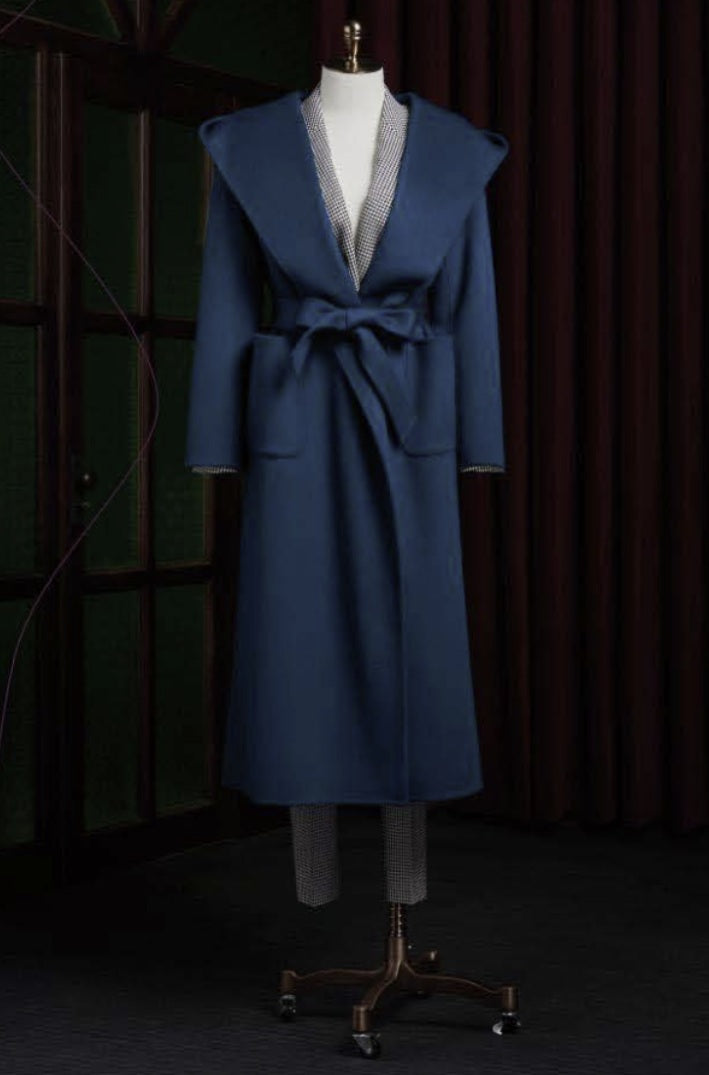 Ladies Blue coat on a mannequin against a dark background