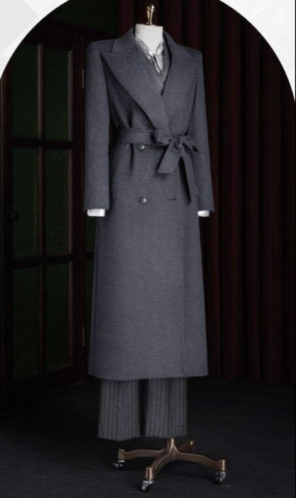 Ladies Grey coat and pants on a mannequin against a dark background
