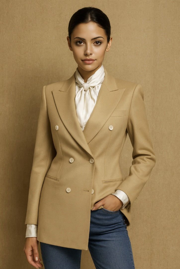 Ladies beige blazer over a white shirt with a brown background