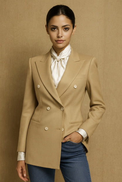Ladies beige blazer over a white shirt with a brown background