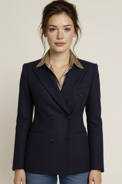 Ladies navy blue blazer over a light shirt with a beige background