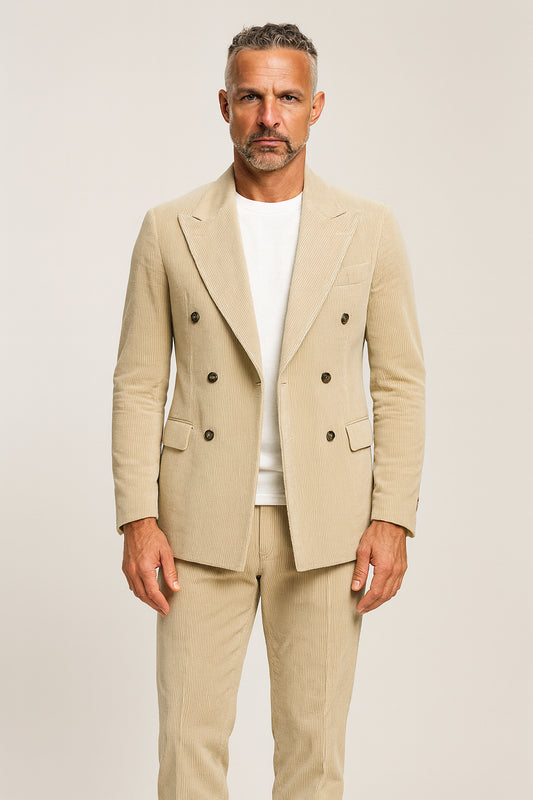 Man wearing a beige suit with a white shirt on a plain background