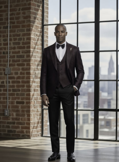 Man in a formal suit standing in front of large windows with a cityscape view.