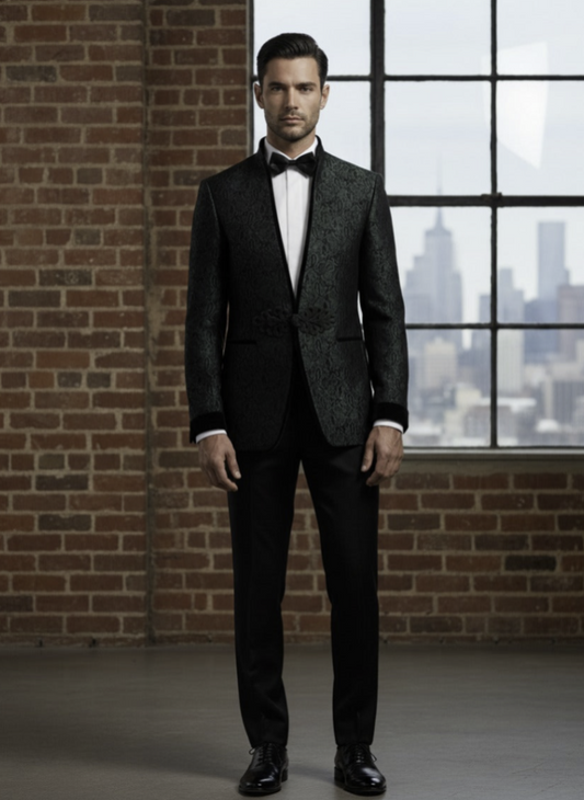 Man in a green and black suit standing in front of a brick wall with a cityscape view.