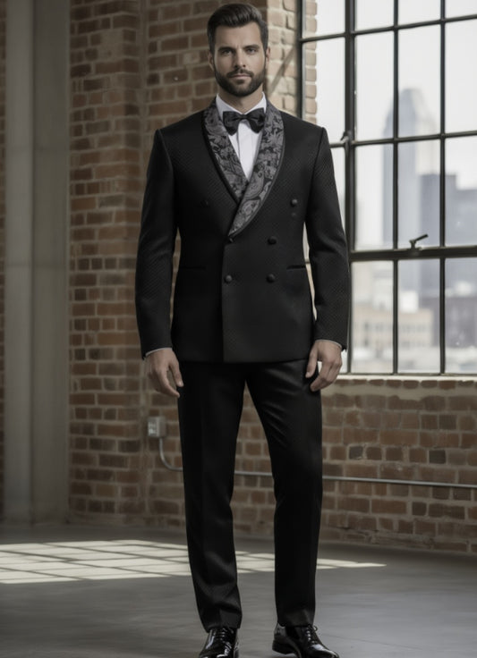 Man wearing a black tuxedo with floral lapels in an urban setting.