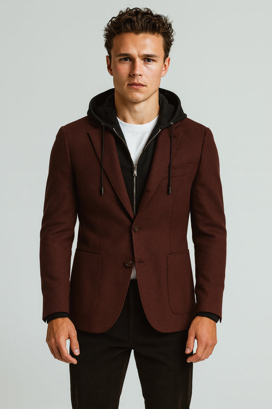 Man wearing a brown blazer with a black hood on a light gray background