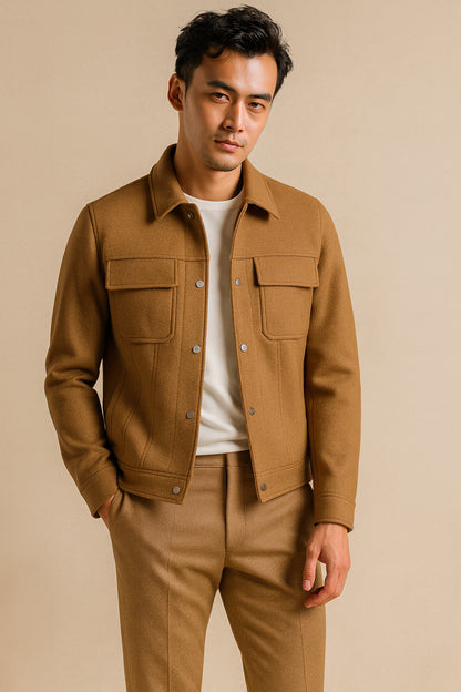 Man wearing a brown jacket and pants on a beige background