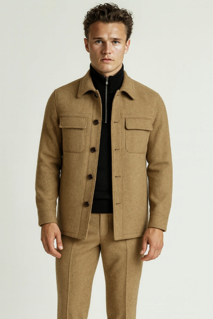 Man wearing a brown jacket and pants on a white background