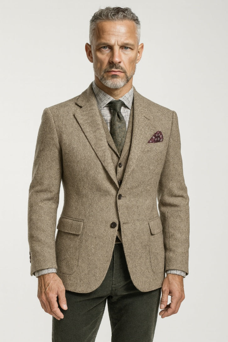 Man wearing a brown tweed suit with a white background