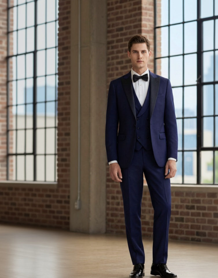 Man_wearing_a_formal_Navy_suit_with_a_bow_tie_in_an_indoor_setting.