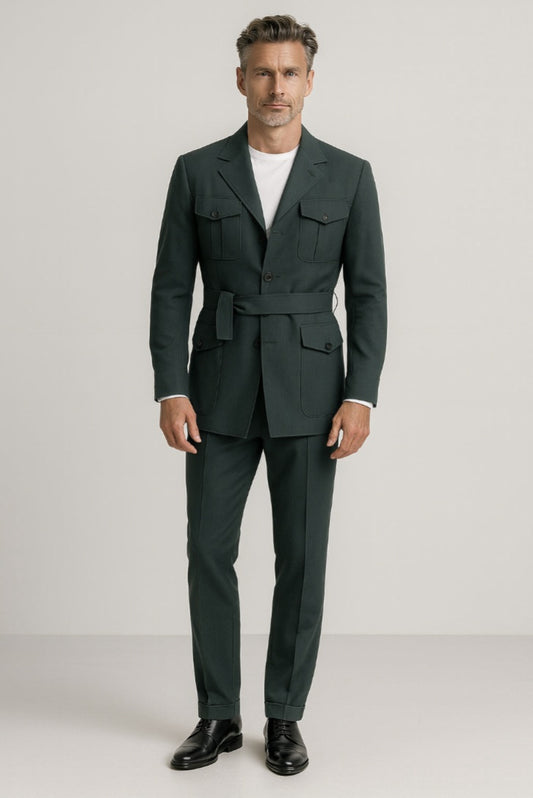 Man wearing a green safari suit with a white T-shirt on a plain background