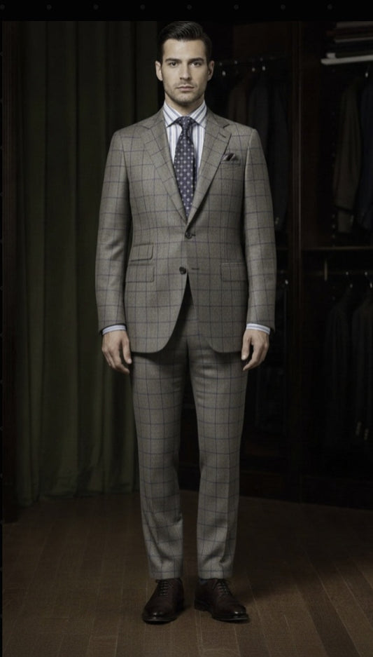 Man wearing a grey checkered suit with a patterned tie in a clothing store.