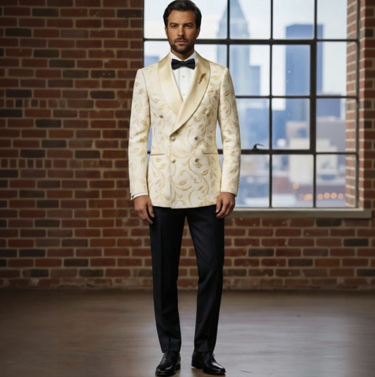 Man wearing a white floral tuxedo with black bow tie and pants, standing in front of a brick wall and window with cityscape view.