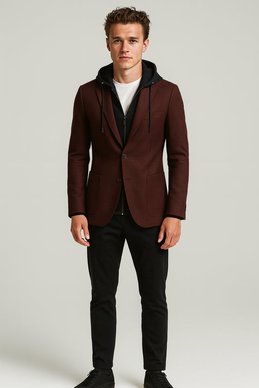 Man wearing a brown blazer with a hood over a black hoodie on a white background