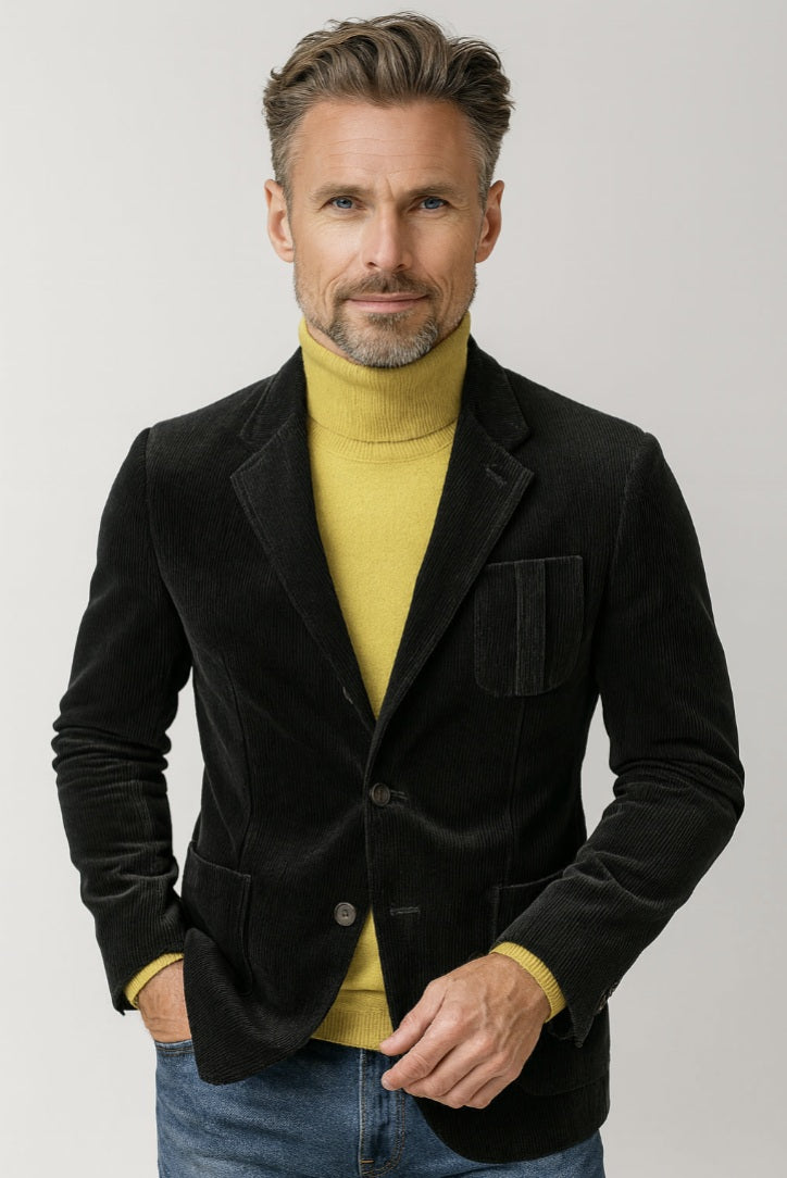 Mens black corduroy casual jacket and trousers, with close-up views on a mannequin and a working cuff button detail. The jacket features a notched lapel, three-button fastening, and front pockets.