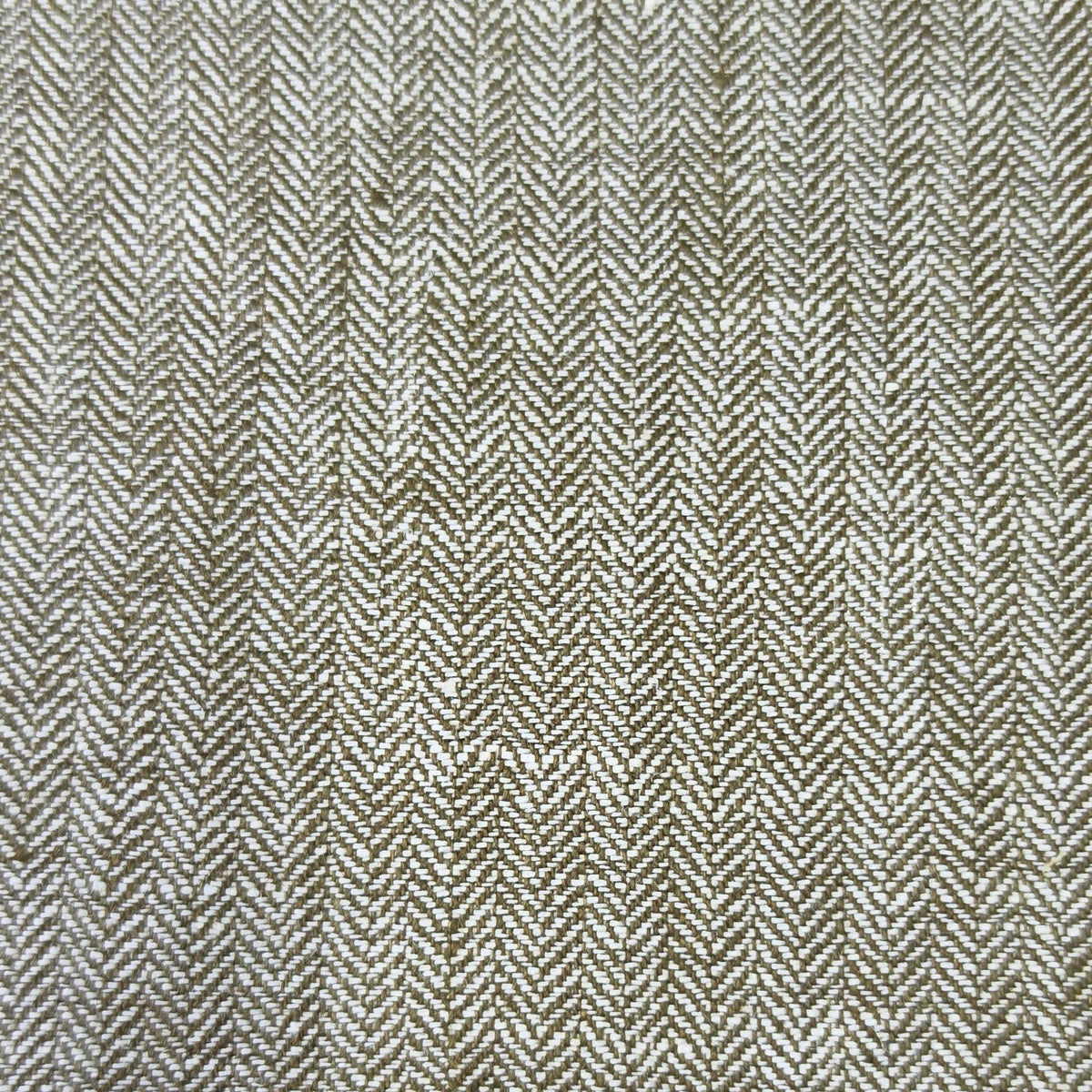 A close-up of a woven fabric with a herringbone pattern in beige and brown tones.
