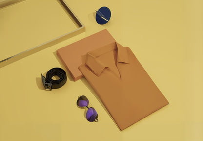 Orange shirt, black belt, purple sunglasses on a yellow background