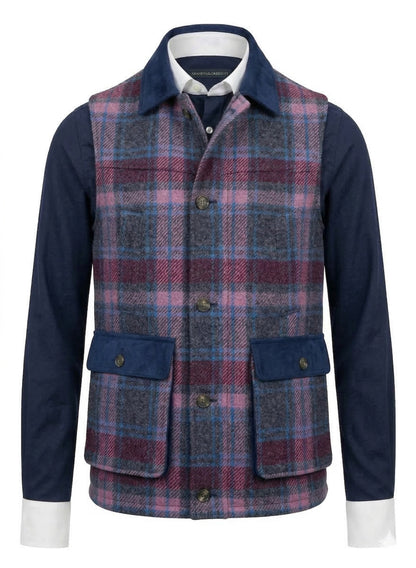 Plaid vest over a navy shirt on a white background