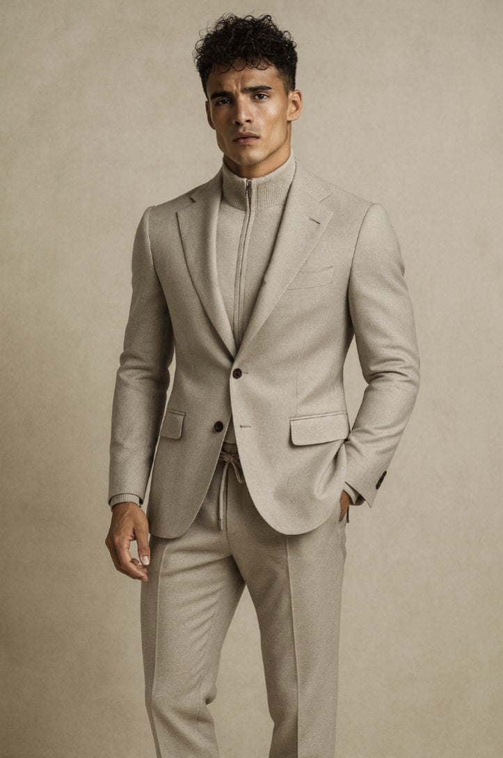 Professional man in beige contemporary bespoke suit with high-neck knit top - modern tailoring by A Hand Tailored Suit